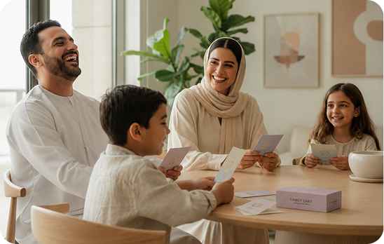 A family talking together at a dinner table with conversation cards